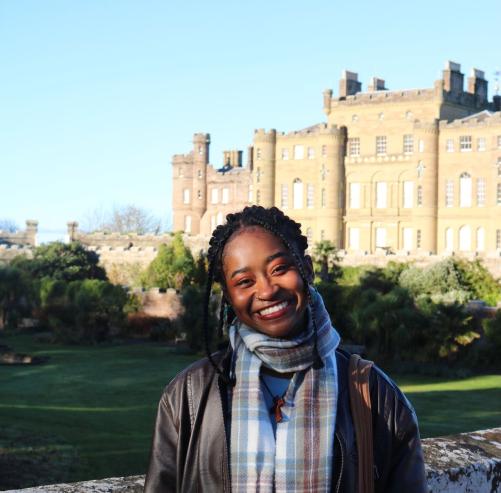 Student in front of castle